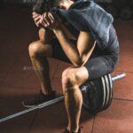 Frustrated-young-sportsman-with-towel-in-hand-sitting-on-barbell-in-gym-150x150 Featured Article